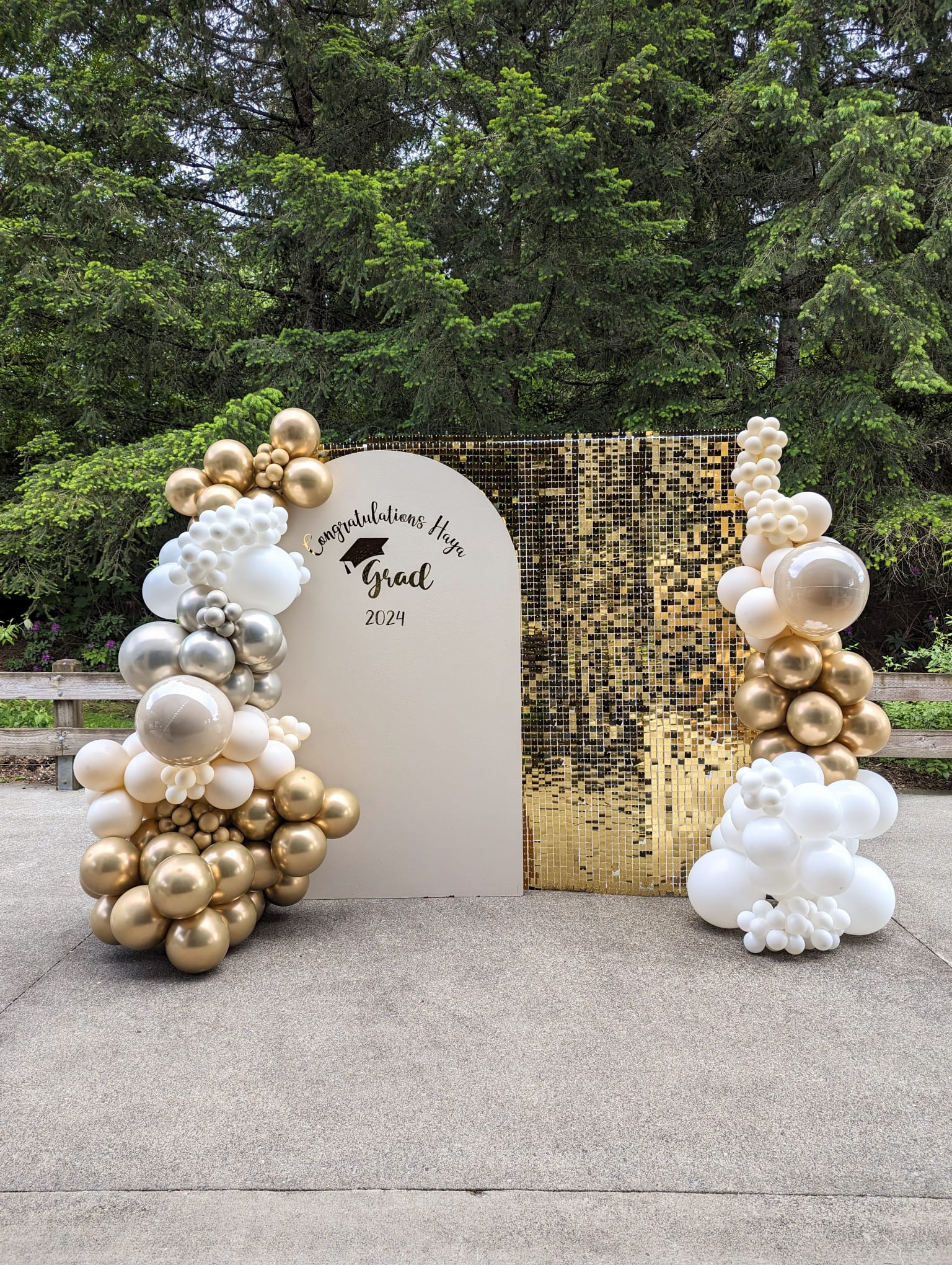congrats grad photo booth - white and gold graduation balloon garland with shimmer wall and custom wood arch